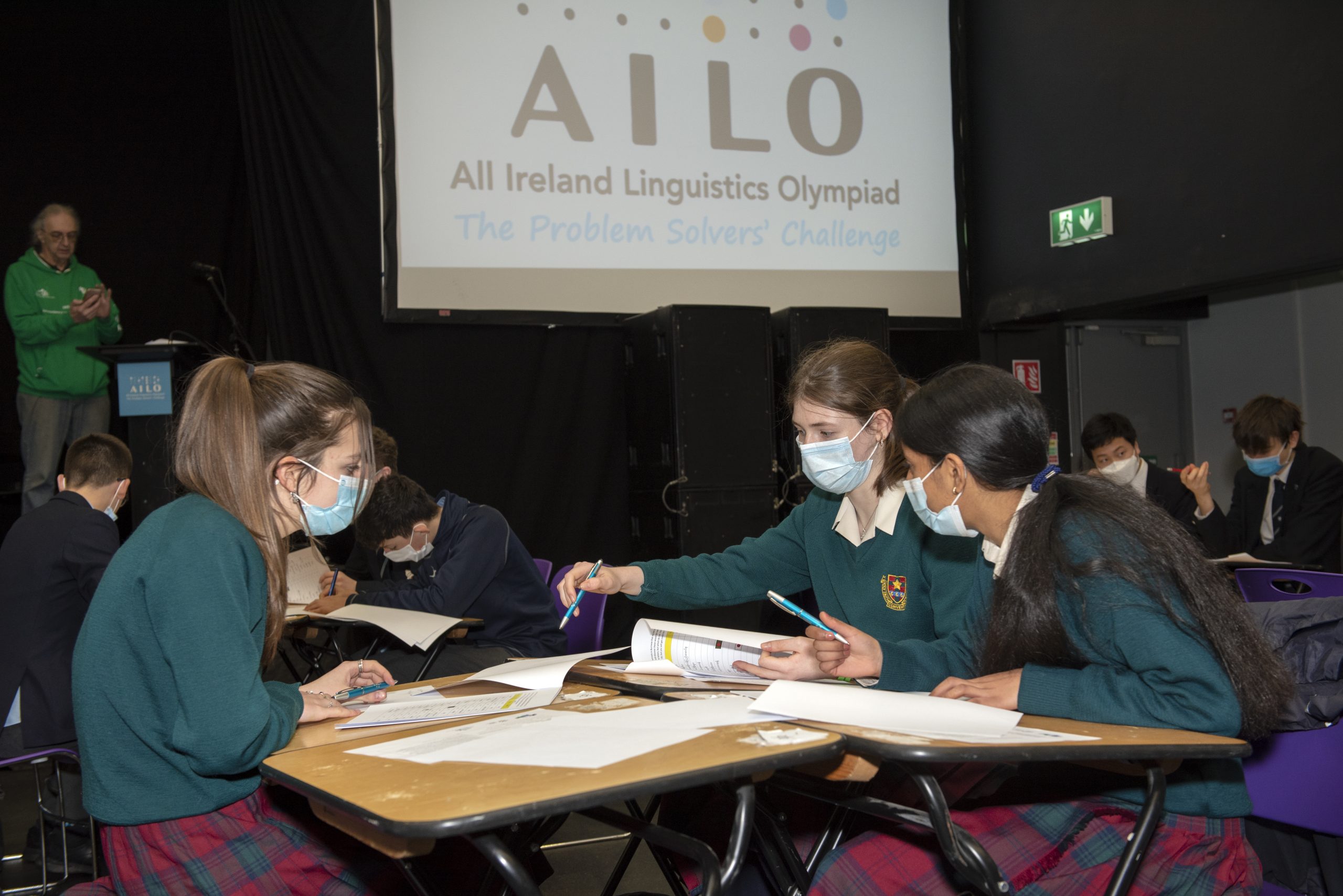 group of teenagers working together to solve linguistic puzzles at the AILO final