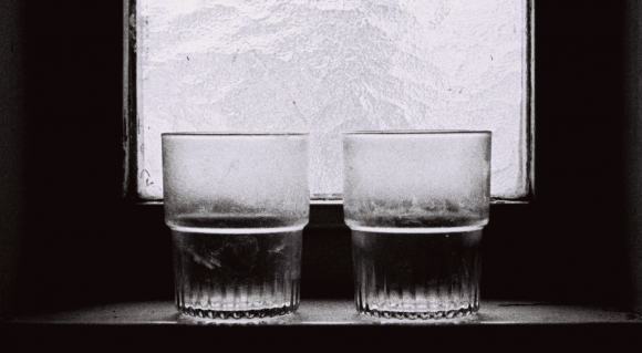 Sombre photo of two dirty drinking glasses