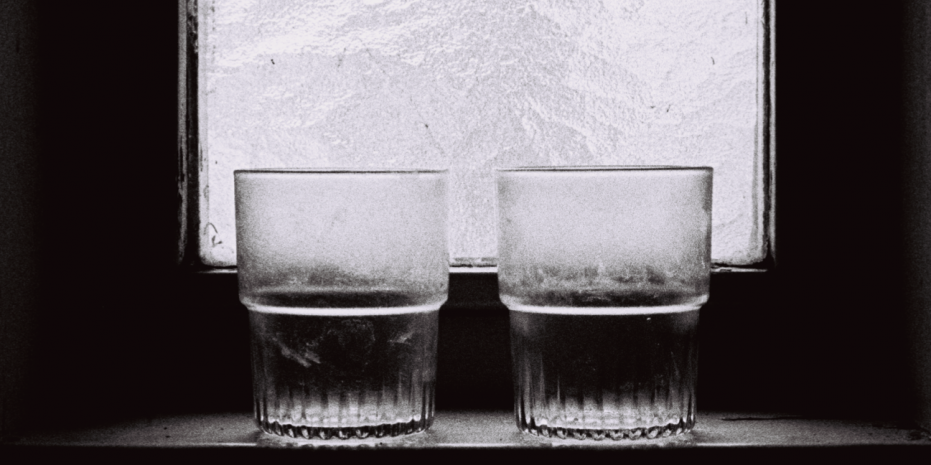 Sombre photo of two dirty drinking glasses