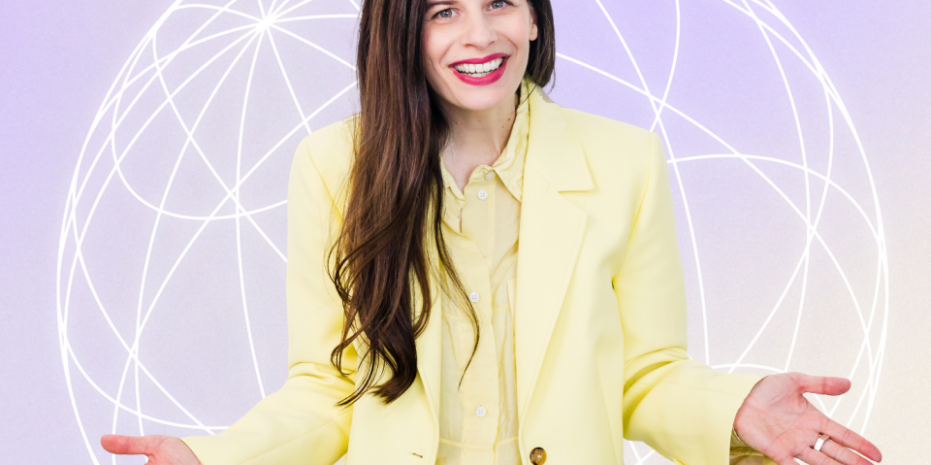 A woman with long brown hair, wearing a yellow suit standing with arms open in front of a lilac background