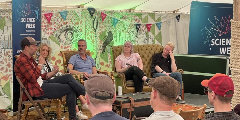 A panel discussion at Electrci Picnic Music and Arts festival. The panel features 5 people sitting in armchairs on a stage.